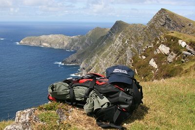 hiking bag on irish cliffside
