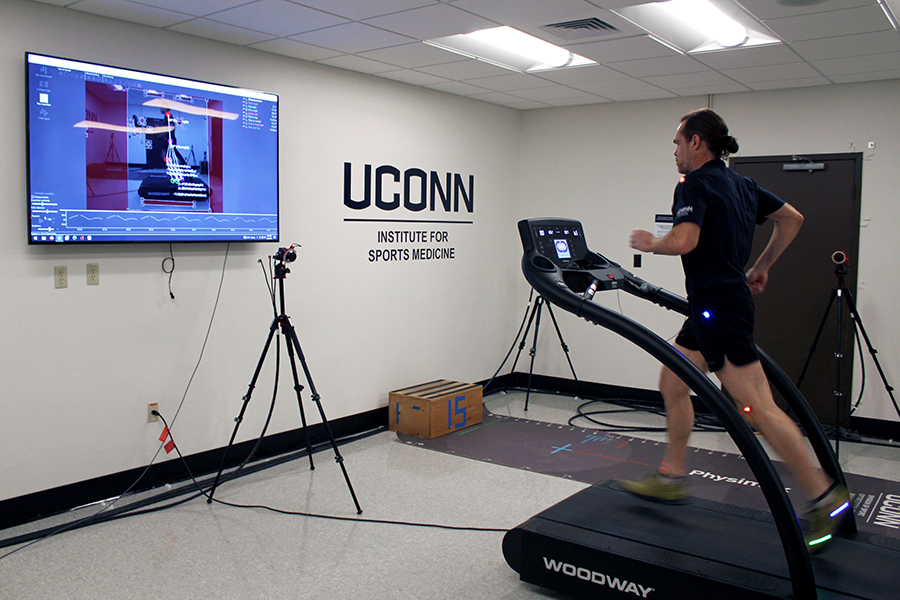 A student runs on a treadmill