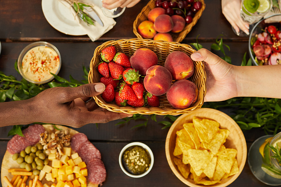passing a basket of fruit