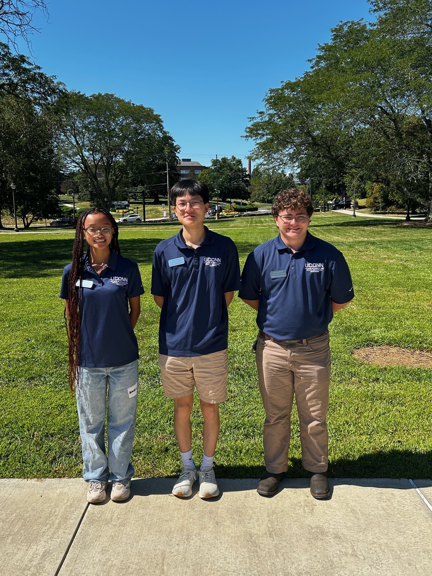 Three CAHNR Ambassadors stand in front of the quad